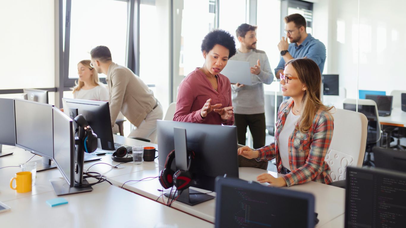 Engineering team reviewing system architecture in meeting